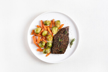 Beef steak with brussels sprouts and sweet potatoes
