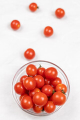 Cherry Tomatoes in the bowl above white background