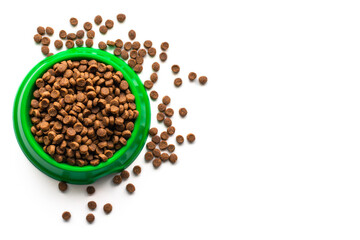 Bowl with dry cat food isolated on white background.