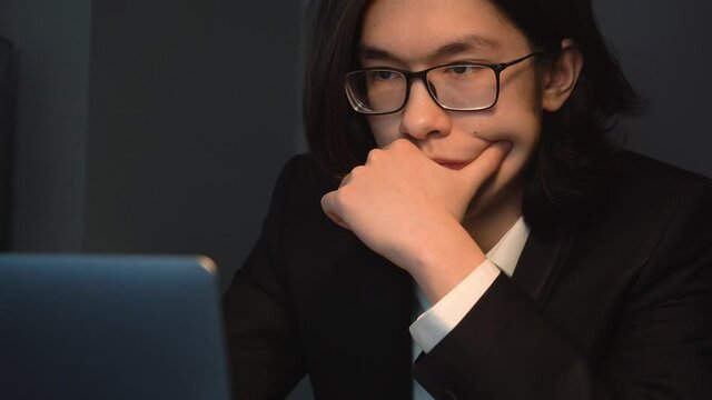 Attractiv Asian Man Typing Working at the Office Concentratedly Thinking Close-up