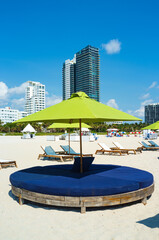 Miami Beach cityscape with colorful umbrellas and resorts