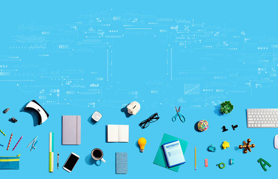 Technology screen with collection of electronic gadgets and office supplies