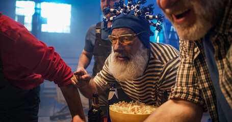 Anxious senior man watching match with friends