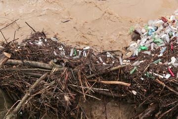 River after flood with plastic and wood pollution . Vlasina river, Serbia. Ecology problem.