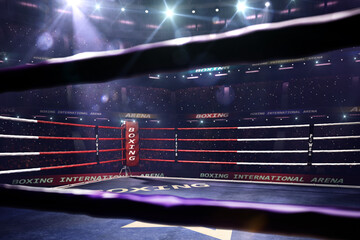 Empty ring boxing arena in the light of a spotlight