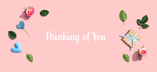 Thinking of you message with a small gift box and roses
