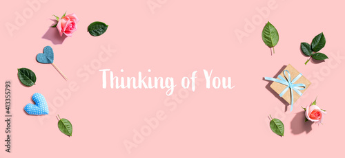 Thinking of you message with a small gift box and roses