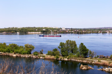 Fototapeta premium the barge floats on the river