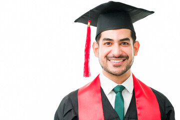 Handsome young man looking happy during his graduation