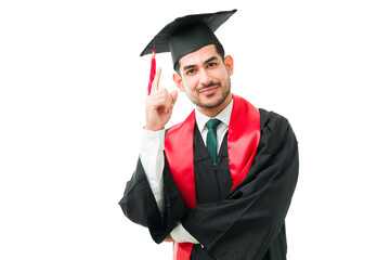 Young male graduate feeling proud to graduate from university