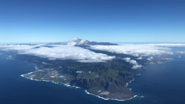 Aerial view of the south of the island of Tenerife with the Teide peak covered in snow