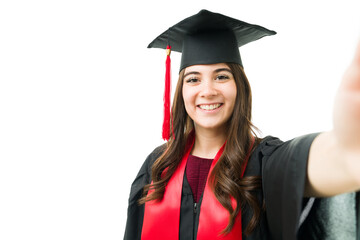 Female graduate posting a graduation photo on her social media