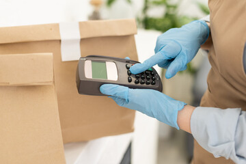 Seller holding payment pos terminal. Space for text