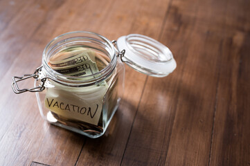 Vacation savings money collected in a jar
