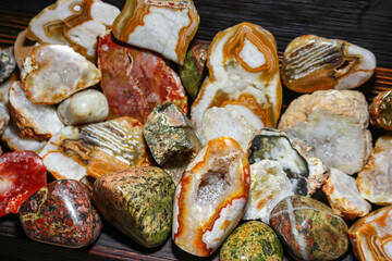 Collection of processed stones close up. Samples of polished stones and minerals