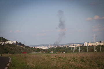 Beautiful landscape of the city from outside with the smoke above the city.
