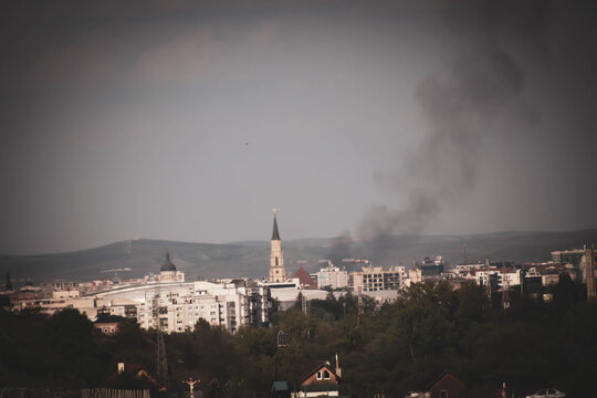 Landscape Of City Zoom In On The Church, Smoke Above The City