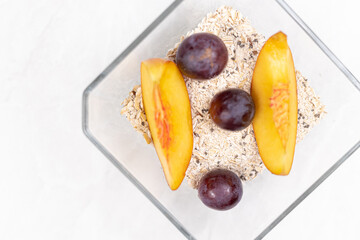 Top view of Peaches served on the plate with grapes