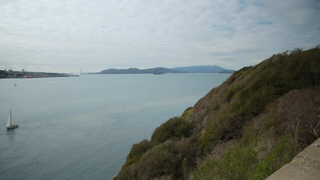Golden Gate Bridge, Alcatraz Island and boat sailing in the bay