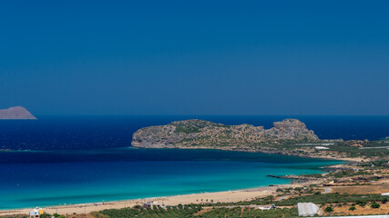 Fototapeta na wymiar Shot of beautiful turquoise beach Falasarna (Falassarna) in Crete, Greece. View of famous paradise sandy deep turquoise beach of Falasarna (Phalasarna) in North West, Crete island, Greece.