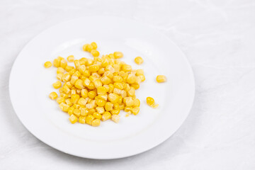 Cooked Sweet Corn above white background