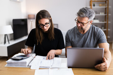 Couple Doing Taxes And Family Budget