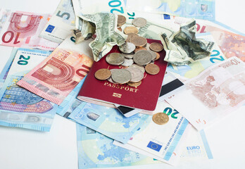 Cash on table isolated: dollars, euro, rubl broken money. All in mess, global crisis . passport travel concept
