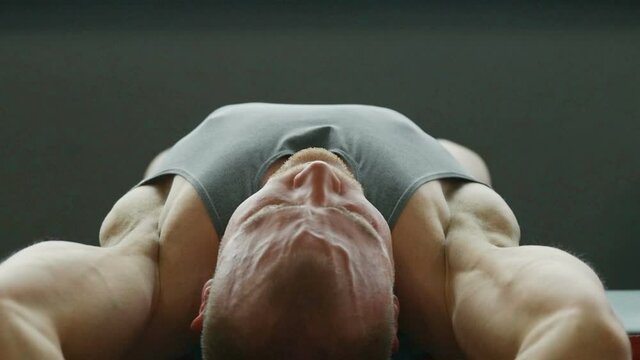 Fitness man doing chest workout in gym. Fitness and bodybuilding healthy concept. Caucasian bodybuilder doing exercises .