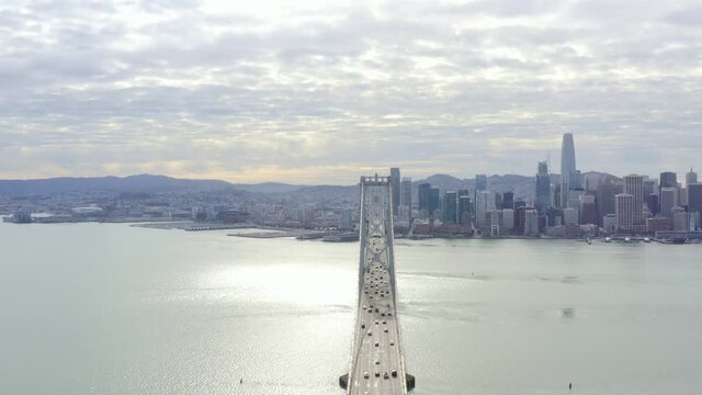 Aerial: people driving over the bridge. drone view
