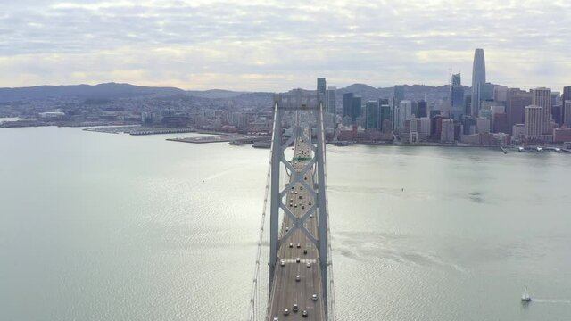 Aerial: bridge over the sea in the city, drone view