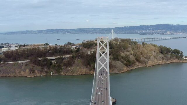 Aerial: cars crossing the bridge, drone view