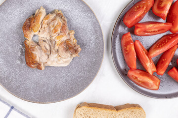 Fried Chicken Drumstick served with tomato salad