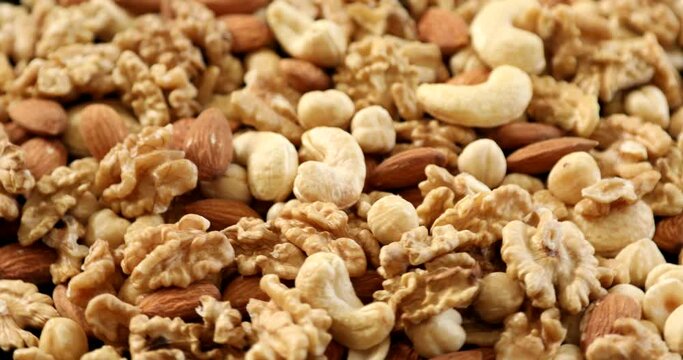 Assorted healthy organic nuts rotating