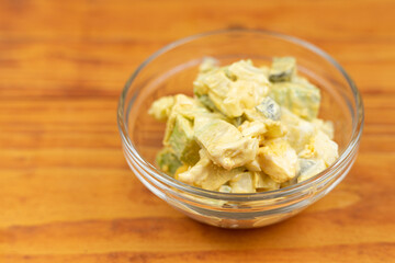 Served Avocado salad with Eggs and Pickles