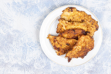 Pork meat Fried in eggs and flour served on the plate