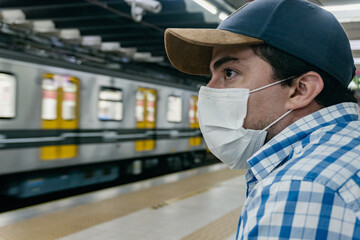 man waiting for subway train