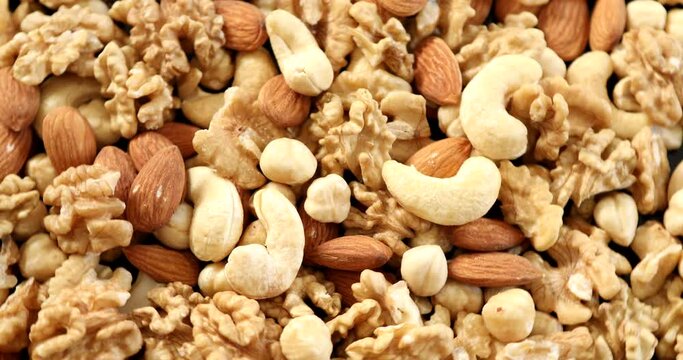 Assorted healthy organic nuts rotating