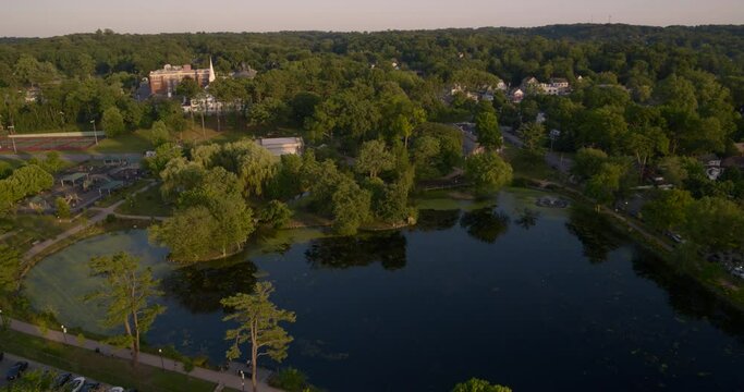 Aerial Tilt Down of Heckscher Park Pond in Huntington Long Island