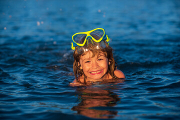 Kids snorkel swimming. Snorkeling diving kid. Boy with mask exploring underwater.