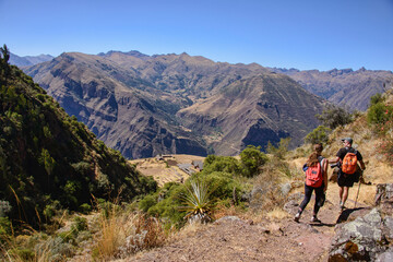 Fototapeta premium Trekking into the remote Inca ruins of Huchuy Qosqo (