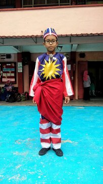 Portrait Of Boy Wearing Malaysian Flag Costume