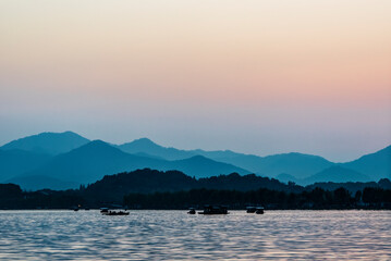 China, Zhejiang, Hangzhou. West Lake sunset.