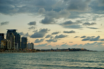 Obraz premium Israel, Tel Aviv at sunset, from Tel Aviv beach, Jaffa in the distance