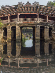 Fototapeta na wymiar Vietnam, Hoi An. Old town historic district (UNESCO World Heritage Site). Japanese Friendship Bridge.