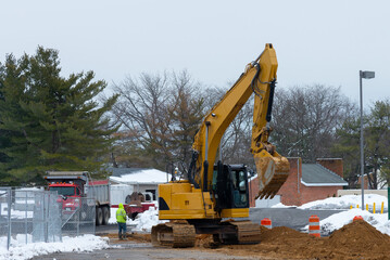 yellow digging excavator