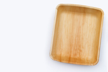 Betel palm leaf plate on white background.