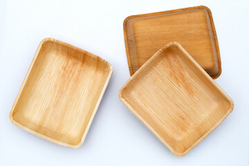 Betel palm leaf plate on white background.