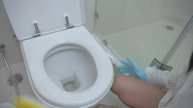 Holiday concept of 4k Resolution. Young women inject cleaner in the bathroom.