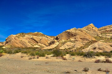 Desert landscape transitioning into California mountains