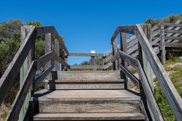 wooden stairs near beach 